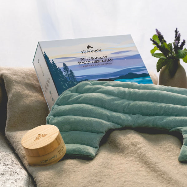 Vital Body shoulder wrap and packaging on a surface with a blurred background