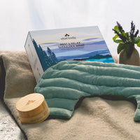 Vital Body shoulder wrap and packaging on a surface with a blurred background