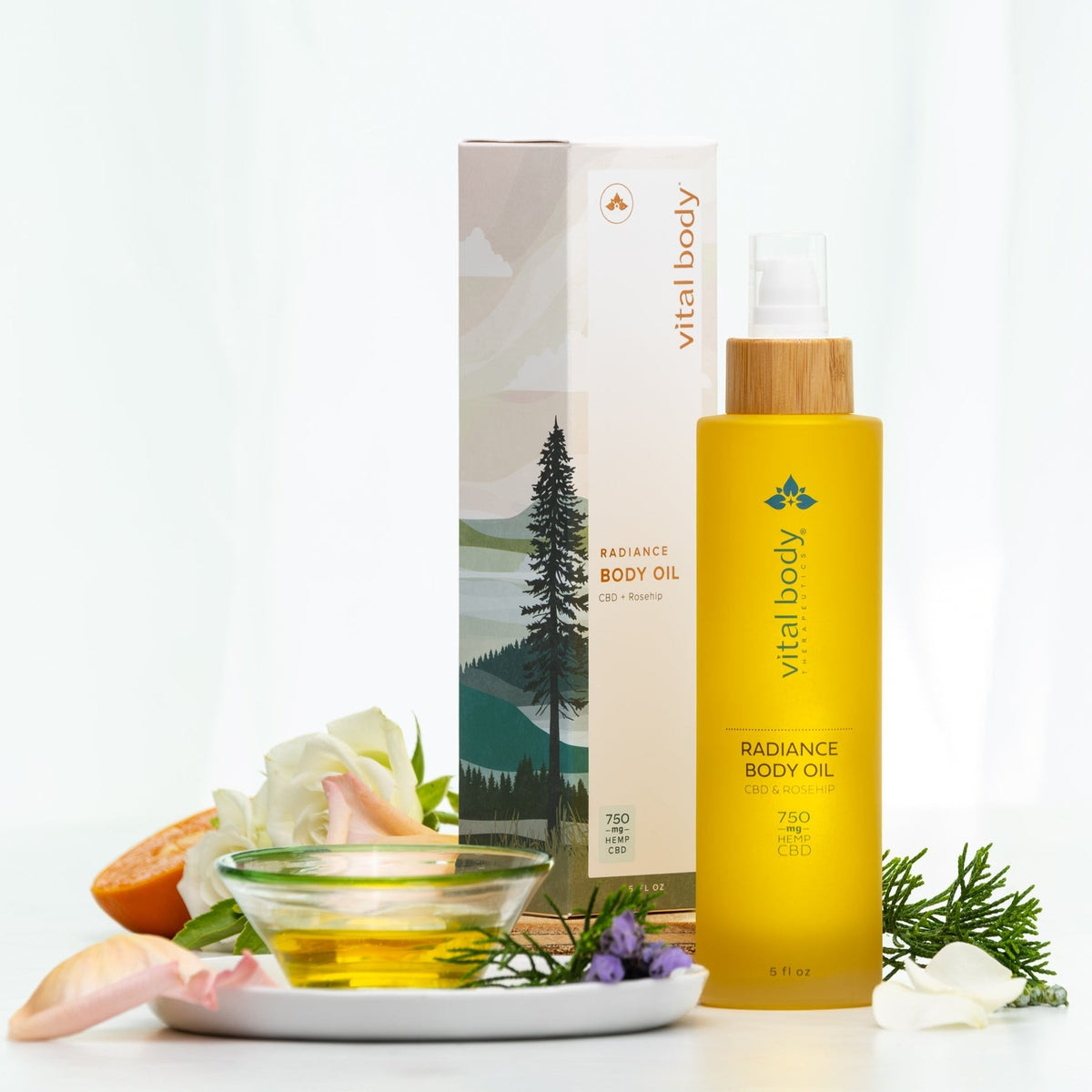 Vital Body Radiance Body Oil with packaging and ingredients on a white background