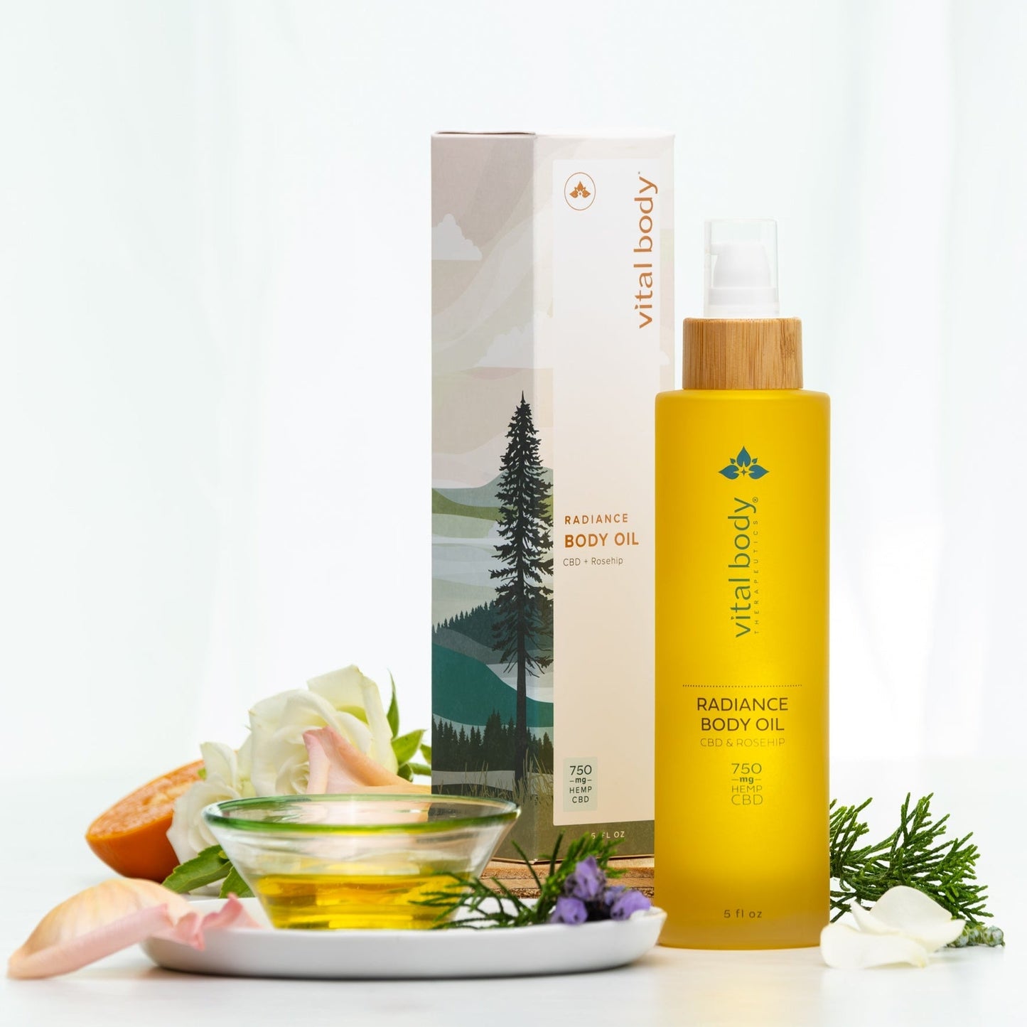 Vital Body Radiance Body Oil with packaging and ingredients on a white background