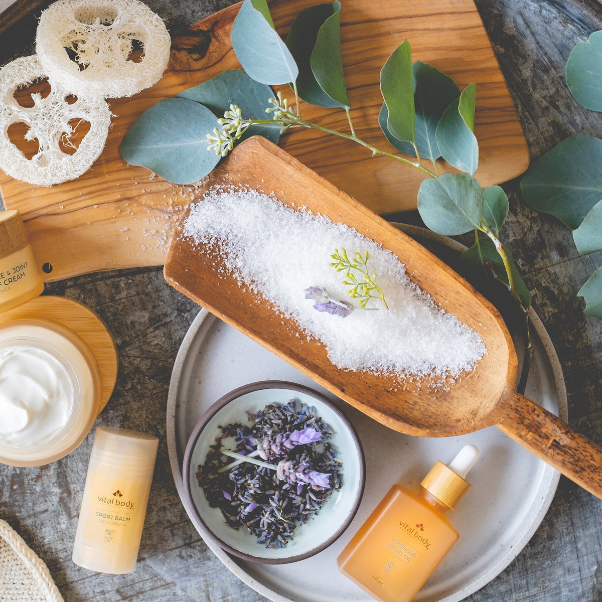 Cosmetic products with natural elements on a wooden surface